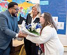 Ellen Jewell, a social studies teacher at Brookland Middle School,is
congratulated Nov. 6 by Ryan Young, Fairfield District representative on the Henrico County School Board, and HCPS Superintendent Amy Cashwell. Jewell is a 2025 recipient of the REB Award for Teaching Excellence.