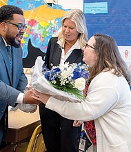 Ellen Jewell, a social studies teacher at Brookland Middle School,is
congratulated Nov. 6 by Ryan Young, Fairfield District representative on the Henrico County School Board, and HCPS Superintendent Amy Cashwell. Jewell is a 2025 recipient of the REB Award for Teaching Excellence.