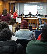 Cathleen Wahl, a River City Middle School teacher, speaks during the Richmond Public Schools board meeting at City Hall on Tuesday, Nov. 11 to stand in solidarity with RPS workers and urge the board to vote against proposed changes to the collective bargaining resolution.