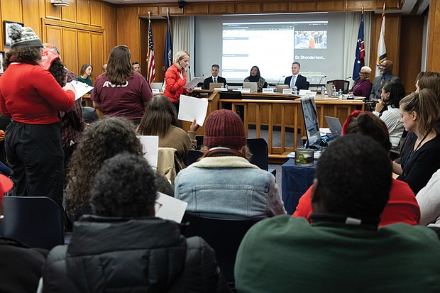 Cathleen Wahl, a River City Middle School teacher, speaks during the Richmond Public Schools board meeting at City Hall on Tuesday, Nov. 11 to stand in solidarity with RPS workers and urge the board to vote against proposed changes to the collective bargaining resolution.