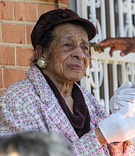 Richmond educator, church leader recognized-Joan Belle Christian looks on during the street renaming ceremony in Jackson Ward on Saturday, Nov. 8. The event honored her lifelong dedication to education and community advocacy as well as to mentoring young leaders across Richmond. Below, the 1600 block of South Meadow Street is now Dr. Joan Belle Christian Street, honoring her decades of service to Richmond’s schools and community. (Julianne Tripp Hillian/Richmond Free Press)
