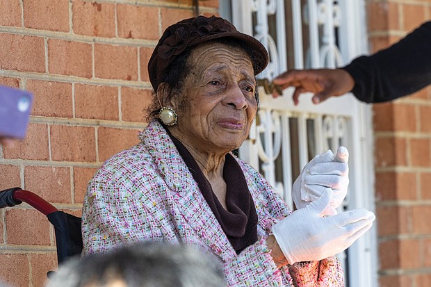 Richmond educator, church leader recognized-Joan Belle Christian looks on during the street renaming ceremony in Jackson Ward on Saturday, Nov. 8. The event honored her lifelong dedication to education and community advocacy as well as to mentoring young leaders across Richmond. Below, the 1600 block of South Meadow Street is now Dr. Joan Belle Christian Street, honoring her decades of service to Richmond’s schools and community. (Julianne Tripp Hillian/Richmond Free Press)