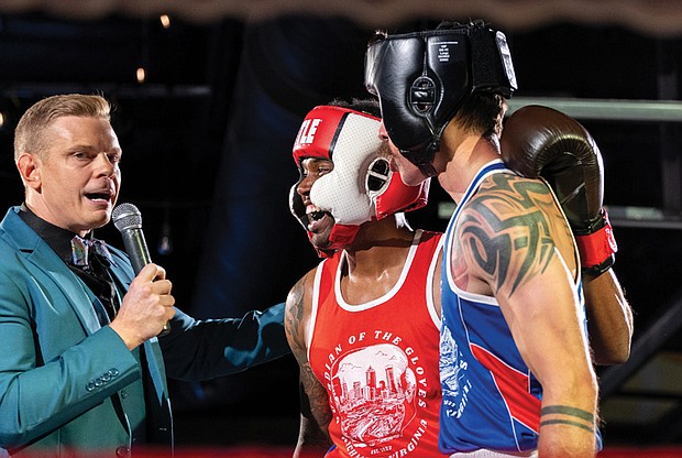 Police, firefighters duke it out for charity-Keivon Henderson of the Richmond City Firefighters shares a post-fight moment with Richmond Police’s Duane Peppel — and the announcer — after their bout. Henderson claimed the win for the firefighters in the charity showdown. Richmond City firefighters and police officers traded gloves for a good cause during River City Fight Night: Red Fight & Blue at River City Roll on Nov. 5. The charity boxing event raised funds for the Children’s Hospital Foundation, selected by the Fire Department, and the American Kidney Fund, chosen by the Police Department. (Julianne Tripp Hillian/Richmond Free Press)