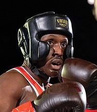 Police, firefighters duke it out for charity- Richmond City firefighters and police officers traded gloves for a good cause during River City Fight Night: Red Fight & Blue at River City Roll on Nov. 5. The charity boxing event raised funds for the Children’s Hospital Foundation, selected by the Fire Department, and the American Kidney Fund, chosen by the Police Department. (Julianne Tripp Hillian/Richmond Free Press)