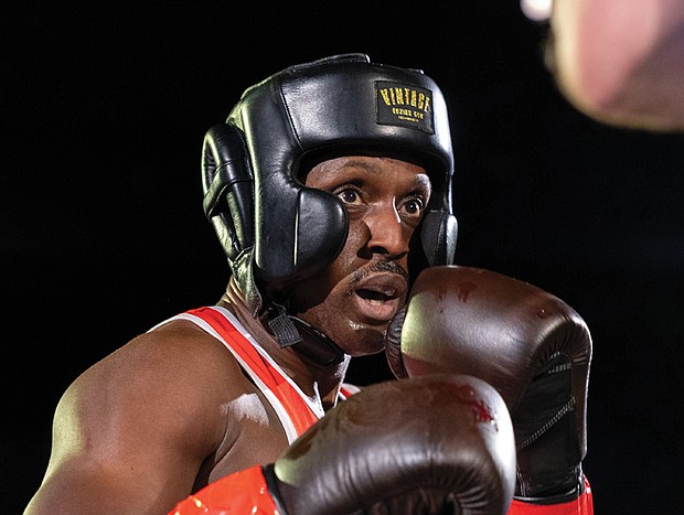 Police, firefighters duke it out for charity- Richmond City firefighters and police officers traded gloves for a good cause during River City Fight Night: Red Fight & Blue at River City Roll on Nov. 5. The charity boxing event raised funds for the Children’s Hospital Foundation, selected by the Fire Department, and the American Kidney Fund, chosen by the Police Department. (Julianne Tripp Hillian/Richmond Free Press)