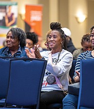 Community tunes in for Radio One’s health expo-Radio One hosted its 2nd Annual Community Health & Wellness Expo on Saturday, Nov. 8, at Victory Theater & Event Center on Midlothian Turnpike. The event encouraged attendees to prioritize their health through panel discussions on physical, mental and spiritual wellness as well as free screenings, health resources and wellness tools. Guests also participated in interactive activities including a 10-minute breathe and stretch session and a 15-minute Zumba class. Chamika McKnight, (second right) a Virginia State
University graduate student, and Kasinda Thomas, (right) a
substance use disorder therapist, listen to a panel discussion. (Julianne Tripp Hillian/Richmond Free Press)