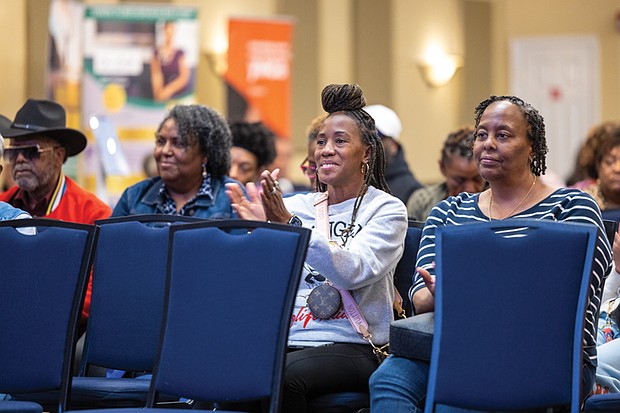 Community tunes in for Radio One’s health expo-Radio One hosted its 2nd Annual Community Health & Wellness Expo on Saturday, Nov. 8, at Victory Theater & Event Center on Midlothian Turnpike. The event encouraged attendees to prioritize their health through panel discussions on physical, mental and spiritual wellness as well as free screenings, health resources and wellness tools. Guests also participated in interactive activities including a 10-minute breathe and stretch session and a 15-minute Zumba class. Chamika McKnight, (second right) a Virginia State
University graduate student, and Kasinda Thomas, (right) a
substance use disorder therapist, listen to a panel discussion. (Julianne Tripp Hillian/Richmond Free Press)