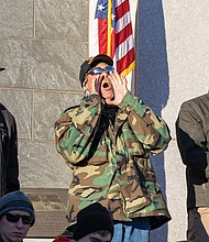 Paying tribute-The ceremonies honored Virginians who have served and those currently serving in the U.S. Armed Forces. Felix H. Shelton, 64, a Marine veteran, chants the Marine battle cry during the 69th Annual Commonwealth’s Veterans Day Ceremony at the Virginia War Memorial on Tuesday, Nov. 11. (Julianne Tripp Hillian/Richmond Free Press)