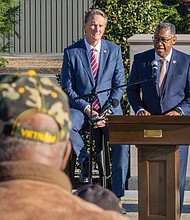 Paying tribute-The ceremonies honored Virginians who have served and those currently serving in the U.S. Armed Forces. Virginia Secretary of Veterans
and Defense Affairs Craig Crenshaw speaks at the ceremony, which also featured remarks from Chuck Zingler, commissioner of the Virginia Department of Veterans Services and musical performances by the Combined Northside High School Chorus from Roanoke. (Julianne Tripp Hillian/Richmond Free Press)