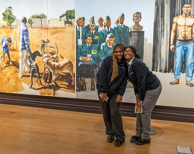 ‘Giants’ excitement-Alicia Keys and Swizz Beatz were welcomed by cheering Richmond-area high school and
college students during a pep rally for the “Giants” exhibition at the Virginia Museum of Fine Arts on Wednesday, Nov. 19. The couple were greeted to the stage by the All-City RPS Drum Line and answered questions about their careers as musical artists. Nevaeh Coles, left, and Ro’miah Short, 9th graders at Cristo Rey Richmond High School, pose together at the exhibition. The students attended the morning pep rally where Alicia
Keys and Swizz Beatz made a surprise appearance.(Julianne Tripp Hillian/Richmond Free Press)