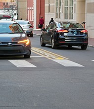 A pilot project at intersections within Virginia Commonwealth University installs modular curbs and new striping to tighten left-turn lanes and improve safety for pedestrians,cyclists and drivers.
