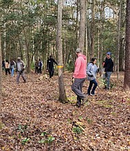Volunteers from area churches and organizations help reclaim Old St. John’s Cemetery in Kilmarnock during a Nov. 15 cleanup.