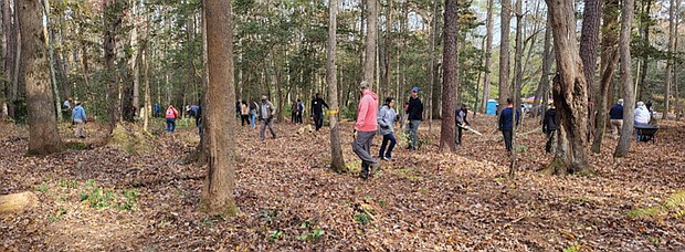 Volunteers from area churches and organizations help reclaim Old St. John’s Cemetery in Kilmarnock during a Nov. 15 cleanup.