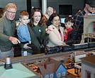 Visitors watch model trains run through miniature towns during the Science Museum of Virginia’s annual Model Railroad Show.