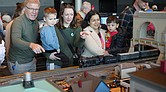 Visitors watch model trains run through miniature towns during the Science Museum of Virginia’s annual Model Railroad Show.