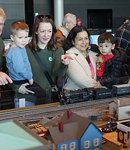 Visitors watch model trains run through miniature towns during the Science Museum of Virginia’s annual Model Railroad Show.