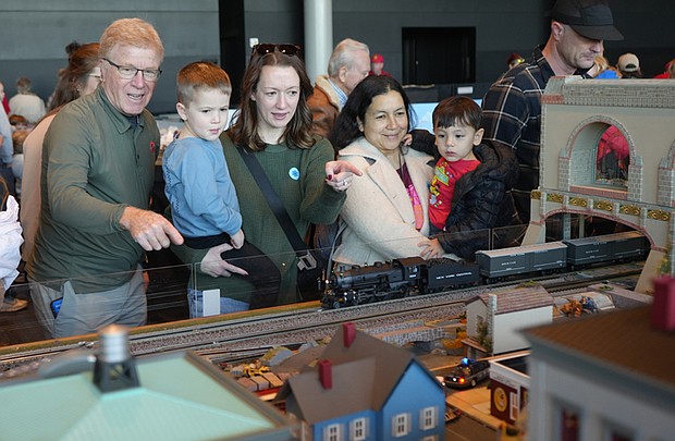 Visitors watch model trains run through miniature towns during the Science Museum of Virginia’s annual Model Railroad Show.
