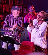 Songs of Truth’ “Songs of Truth: An American Musical Resurrection,” featuring Desirée Roots as Sojourner Truth, was performed Saturday, Nov. 15, and Tuesday, Nov. 18, at Révéler in Carytown. The two performances featured original songs from a musical theater project and inspired by the life of Sojourner Truth. Roots and fellow cast members Kimberly Fox Knight, Wendy Miller, Wanda Fox Miller, Dale Heiskill, Milani Hopkins, Cat Johnson and Sir Rome were accompanied by a band led by Weldon Hill, bringing the abolitionist’s story to life through a fusion of gospel, blues, jazz and Americana. Sojourner Truth’s sixth-generation great-granddaughter Barbara Allen, attended the performances. DKeni B. Fine, creator of Songs of Truth, and Desirée Roots, portraying Sojourner
Truth, dance on stage while Sir Rome, right, and Dale Heiskill, left, provide vocals. (Photos by Julianne Tripp Hillian/Richmond Free Press)