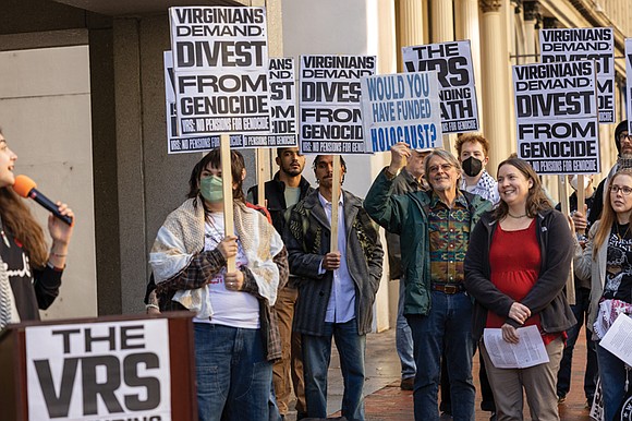 About 30 demonstrators rallied outside the Virginia Retirement System headquarters on Nov. 13, demanding the fund divest from companies they …