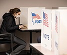 A voter casts a ballot at the Fairfax County Government Center in 2020.