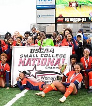 Virginia State women’s soccer players celebrate on the field after their 1–0 win over Shaw University to claim the USCAA Division I national championship.