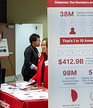 Driving home diabetes awareness-A brightly wrapped Estes Express Lines trailer, designed to raise awareness about diabetes, was parked outside Reynolds Community College’s Parham Road Campus as attendees arrived for the American Diabetes Association’s State of Diabetes: Central Virginia on World Diabetes Day, Nov. 14. Inside, employers, health care professionals and community members discussed the impact of diabetes and obesity and strategies for prevention and care. (Julianne Tripp Hillian/Richmond Free Press)