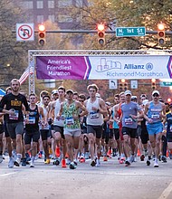 Finishing strong-About 21,000 runners took part in the 48th Allianz Richmond Marathon, known as America’s friendliest marathon. Crowds lined the streets, bands played along the course, and volunteers cheered runners on as they made their way to the iconic downhill finish. (Photo by Sandra Sellars/Richmond Free Press)