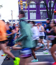 Finishing strong-About 21,000 runners took part in the 48th Allianz Richmond Marathon, known as America’s friendliest marathon. Crowds lined the streets, bands played along the course, and volunteers cheered runners on as they made their way to the iconic downhill finish. Runners make their way along the course during the Richmond Marathon. (Photo by Sandra Sellars/Richmond Free Press)
