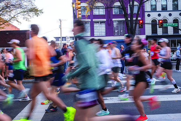 Finishing strong-About 21,000 runners took part in the 48th Allianz Richmond Marathon, known as America’s friendliest marathon. Crowds lined the streets, bands played along the course, and volunteers cheered runners on as they made their way to the iconic downhill finish. Runners make their way along the course during the Richmond Marathon. (Photo by Sandra Sellars/Richmond Free Press)