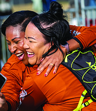 Finishing strong-About 21,000 runners took part in the 48th Allianz Richmond Marathon, known as America’s friendliest marathon. Crowds lined the streets, bands played along the course, and volunteers cheered runners on as they made their way to the iconic downhill finish. Sadhari Cowan and Blair Jeffress celebrate after reaching the finish line of the 8K. (Photo by Sandra Sellars/Richmond Free Press)