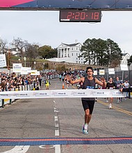 Finishing strong-About 21,000 runners took part in the 48th Allianz Richmond Marathon, known as America’s friendliest marathon. Crowds lined the streets, bands played along the course, and volunteers cheered runners on as they made their way to the iconic downhill finish. Sam Montclair of Cary, N.C., at the finish line before winning the 2025 Allianz
Richmond Marathon. (Photo by Sandra Sellars/Richmond Free Press)