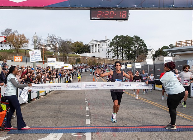 Finishing strong-About 21,000 runners took part in the 48th Allianz Richmond Marathon, known as America’s friendliest marathon. Crowds lined the streets, bands played along the course, and volunteers cheered runners on as they made their way to the iconic downhill finish. Sam Montclair of Cary, N.C., at the finish line before winning the 2025 Allianz
Richmond Marathon. (Photo by Sandra Sellars/Richmond Free Press)