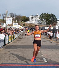 Finishing strong-About 21,000 runners took part in the 48th Allianz Richmond Marathon, known as America’s friendliest marathon. Crowds lined the streets, bands played along the course, and volunteers cheered runners on as they made their way to the iconic downhill finish. Casey Mulroy crosses the finish line first among women at the 2025 Allianz Richmond Marathon with a victorious smile. (Photo by Sandra Sellars/Richmond Free Press)