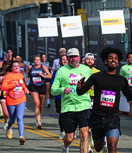 Finishing strong-About 21,000 runners took part in the 48th Allianz Richmond Marathon, known as America’s friendliest marathon. Crowds lined the streets, bands played along the course, and volunteers cheered runners on as they made their way to the iconic downhill finish. (Photo by Sandra Sellars/Richmond Free Press)