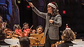Conductor Hae Lee leads the Richmond Symphony during the “Let It Snow” holiday program at the Carpenter Theatre.