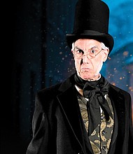 Thomas Adrian Simpson portrays Ebenezer Scrooge in the holiday play ‘A Christmas Carol.’