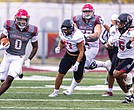 Virginia Union University’s Curtis Allen (0) fights for yardage as the Panthers fall 27-24 to California (PA) in NCAA Division II playoff action on Nov. 22.