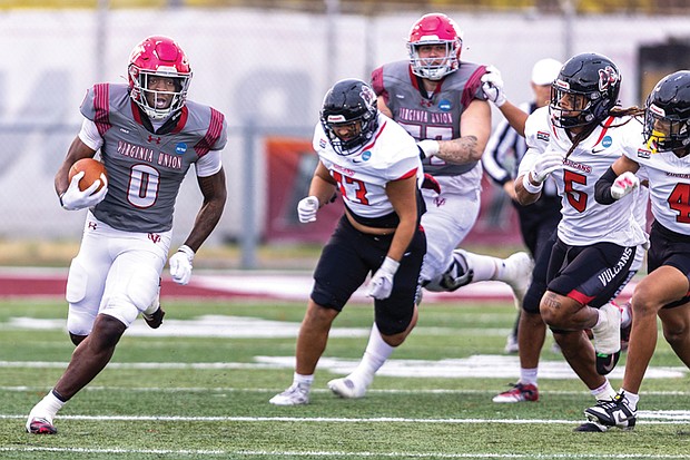 Virginia Union University’s Curtis Allen (0) fights for yardage as the Panthers fall 27-24 to California (PA) in NCAA Division II playoff action on Nov. 22.