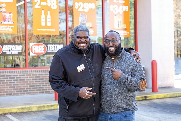 Tony Williams, left, and William Minor stand outside the AutoZone on Hull Street, where Williams works, on Nov. 13. The two recently reconnected at
the store decades after Williams helped Minor at the scene of a car crash — an act Minor says likely saved his life.