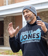 Hands and hearts at work as families receive holiday meals-Families line up at River City Middle School on Richmond’s South Side on Saturday, Nov. 22 for Del. Michael Jones’ seventh annual Turkey Giveaway and Resource Fair, where about 2,000 turkeys and boxes of stuffing were handed out from 9 a.m. to 3 p.m. (Julianne Tripp Hillian)
