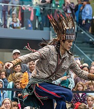 Culture in motion-A dancer with the Tsenacommacah Intertribal Dance Group performs a traditional dance during Family Powwow Day at the Virginia Museum of Fine Arts on Saturday, Nov. 22. The event, presented with the Pocahontas Reframed Film Festival, highlights Native American culture and perspectives. (photo by Julianne Tripp/Hillian)