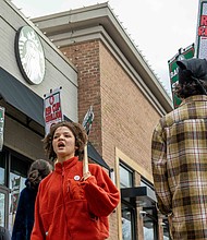 Hope Maddox, a Starbucks barista, joins the Richmond Starbucks Workers United picket line on Wednesday, Nov. 26, outside the West Cary Street location. Baristas from multiple stores across the city participated in the unfair labor practice strike — one of many held at 95 stores in 65 cities nationwide, involving more than 2,000 union Starbucks workers. Julianne Tripp Hillian / Richmond Free Press