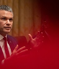 Defense Secretary Pete Hegseth speaks in front of President Donald Trump during a cabinet meeting at the White House in Washington, DC on December 2, 2025.