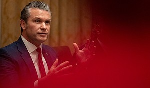 Defense Secretary Pete Hegseth speaks in front of President Donald Trump during a cabinet meeting at the White House in Washington, DC on December 2, 2025.