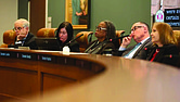 Senators listen to speakers at a Senate Finance and Appropriations subcommittee meeting on higher education on Monday.