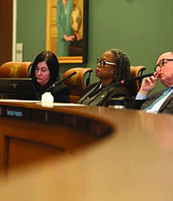 Senators listen to speakers at a Senate Finance and Appropriations subcommittee meeting on higher education on Monday.