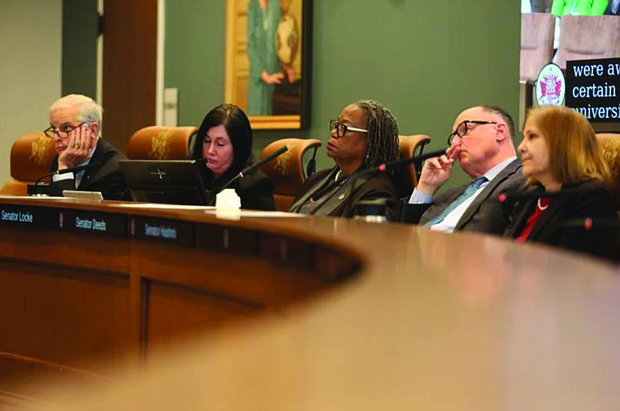 Senators listen to speakers at a Senate Finance and Appropriations subcommittee meeting on higher education on Monday.