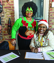 Soul of Christmas-Children and families visited the Black History Museum &
Cultural Center of Virginia on Nov. 29 for the annual Soul Santa Experience. The museum will host two more Saturdays, Dec. 6 and Dec. 13, from 11 a.m. to 3 p.m. as part of Community Access Days with free admission and optional donations. Attendees can hear holiday stories, join arts and crafts activities and browse the museum gift shop for items such as the Ebonyopoly board game. Volunteers Michaele’ McKeever-Davis and
Trayc Freeman welcome guests to the museum. (photo by Julianne Tripp Hillian/Richmond Free Press)