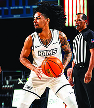 VCU’s Terrence Hill Jr. (06) handles the ball during the Rams’ Battle 4 Atlantis matchup with Virginia Tech.