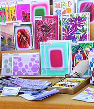 Small Business Saturday brings community, commerce together-Shoppers filled Sheppard Street on Nov. 29 for the Small Business Saturday Market hosted by RVA Galleries between Floyd and Ellwood avenues. The market featured 75 vendors offering everything from ceramics and fine art to spirits and locally made food. Cards and goods made by Renee Stramel are displayed at the market. ((photo by Julianne Tripp Hillian/Richmond Free Press)